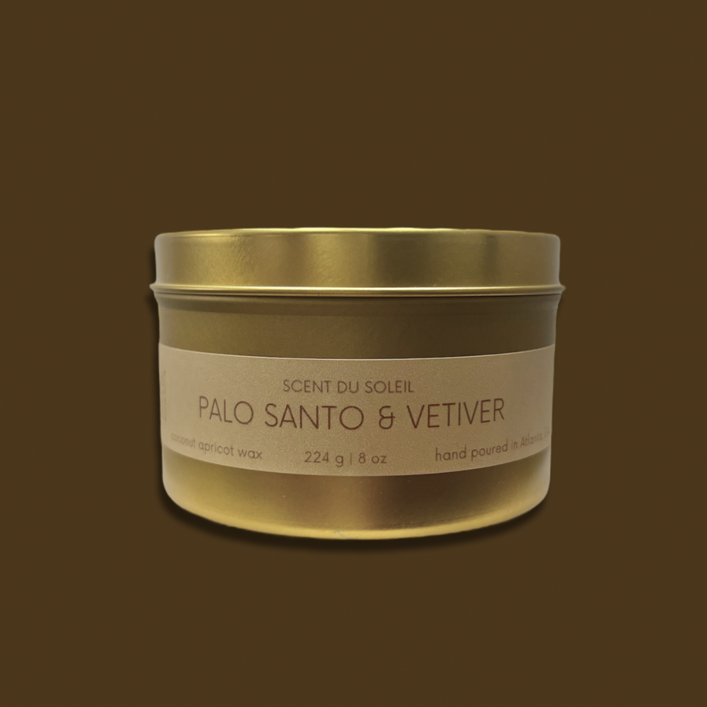 8 ounce gold candle scented with Palo santo and vetiver